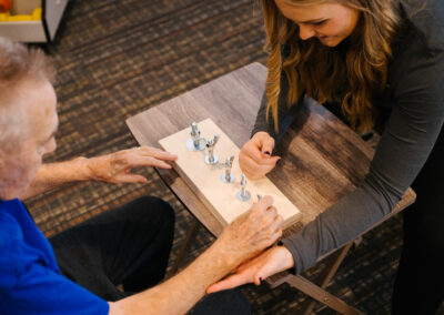 Nurse practicing dexterity exercises with resident