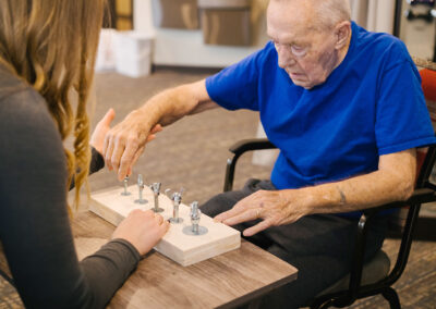 Nurse practicing dexterity exercises with resident