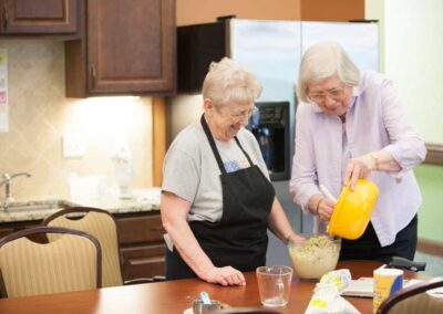 Two senior women cooking